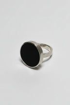 Silver ring with black acrylic front